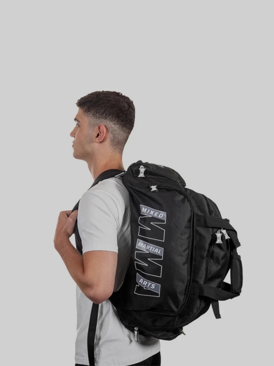 Athlete wearing the Metal Boxing MMA bag in backpack mode for maximum comfort