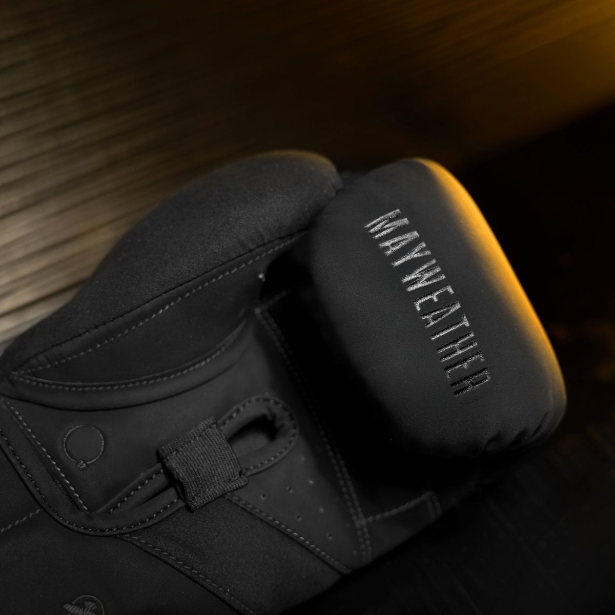 Detail of the internal padding and angled grip bar of the black Mayweather Champ gloves