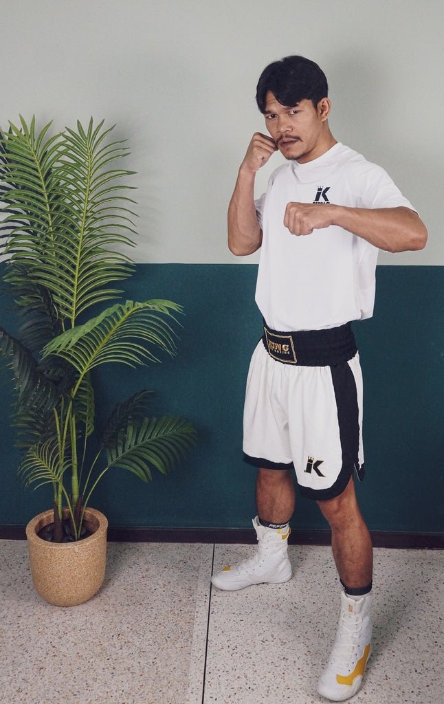 Boxer wears the white K King Apex Pro shorts showing off the professional fit in the ring