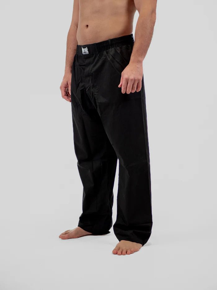 Front detail of black Krav Maga Metal Boxing pants, focus on anti-tear ripstop texture