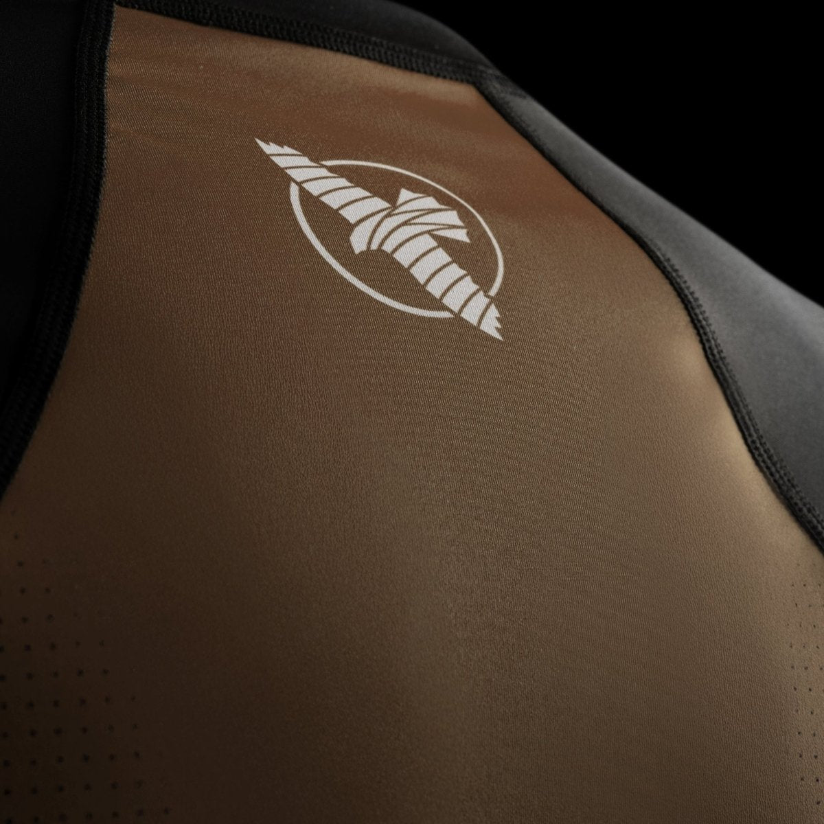 Technical detail of the Hayabusa logo printed on the brown Pro Ranked rashguard