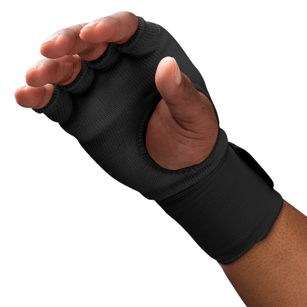 Close-up detail of the gel-padded knuckles of the worn black Hayabusa glove