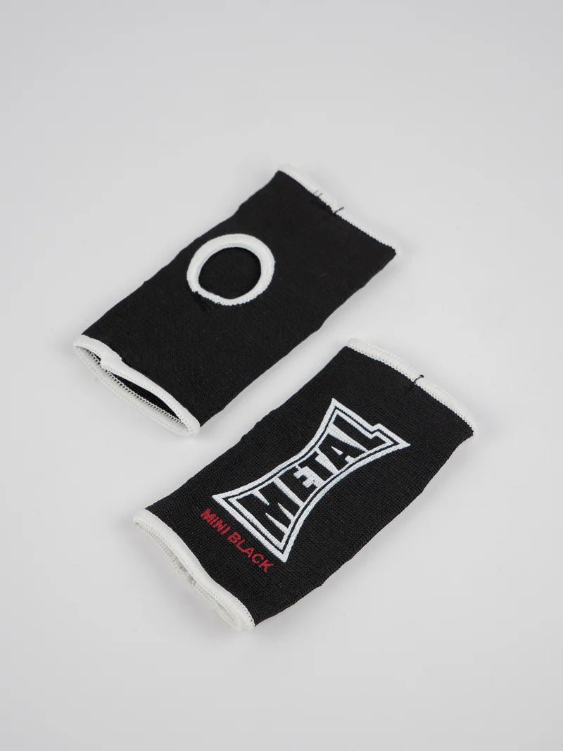 Pair of black Metal Boxing half-finger gloves spread out, detail of the elastic fabric for children 6-10 years