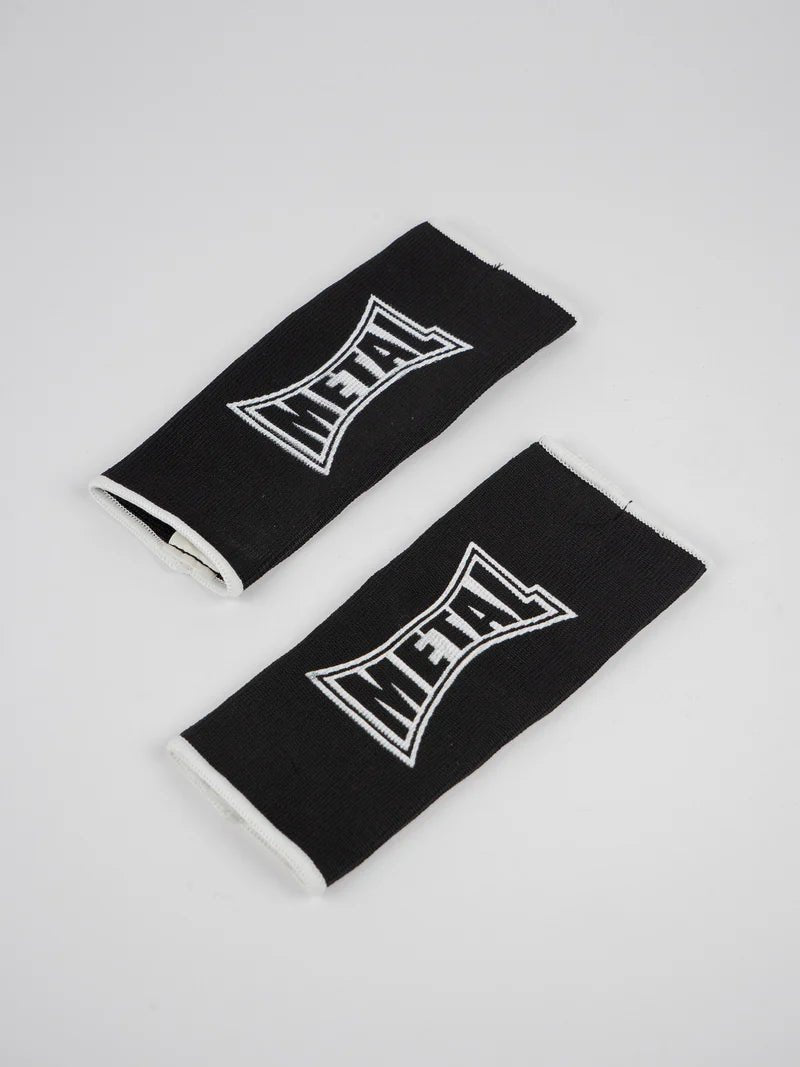 Pair of black Metal Boxe half-finger gloves laid out, detail of the elastic fabric