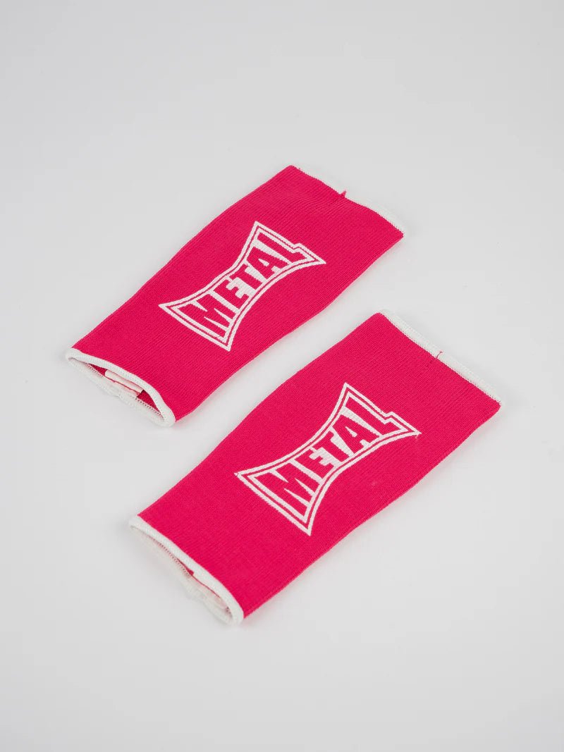Pair of pink Metal Boxe half-finger gloves laid out, detail of the elastic fabric