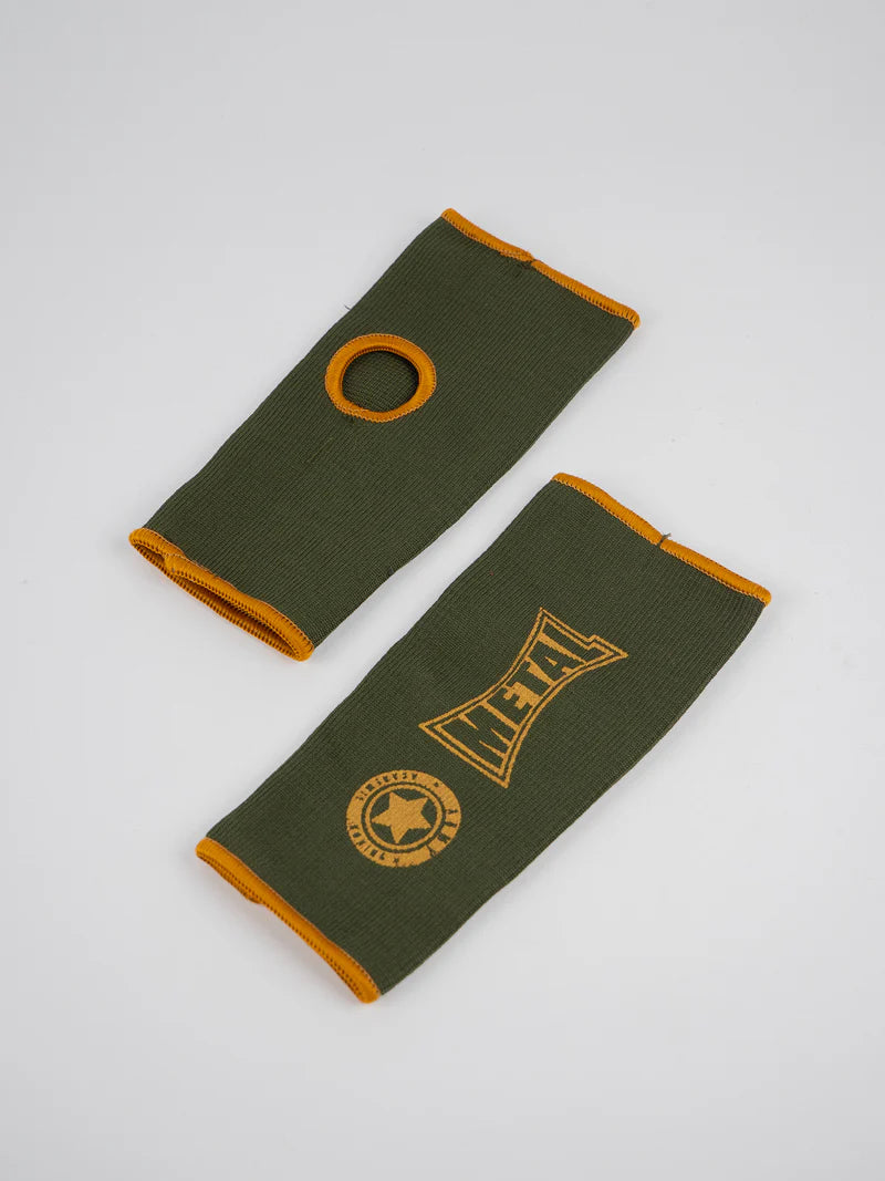 Pair of military green Metal Boxe half-finger gloves lying flat, detail of the elastic fabric