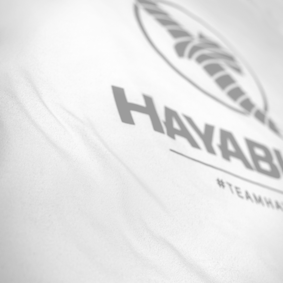 Detail cetakan silikon matte #TeamHayabusa pada kaos putih