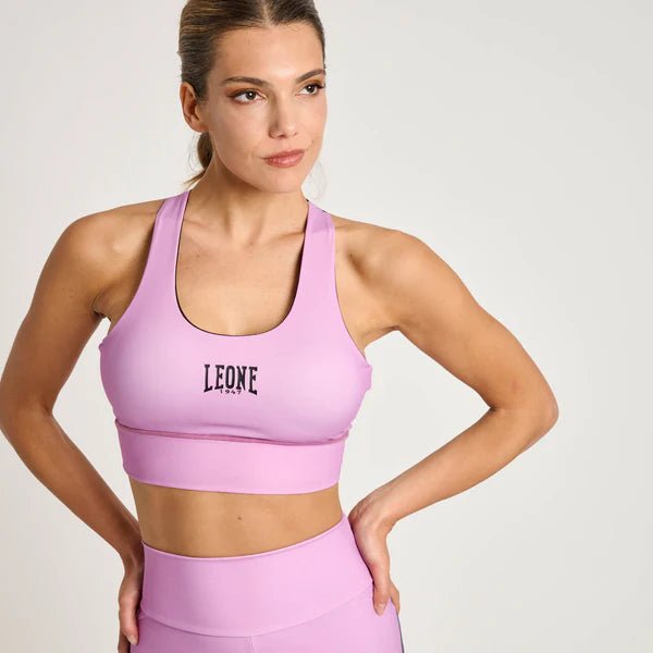 Framifrån av Leone Stripe 47 tekniska sporttopp i rosa med grafiska detaljer