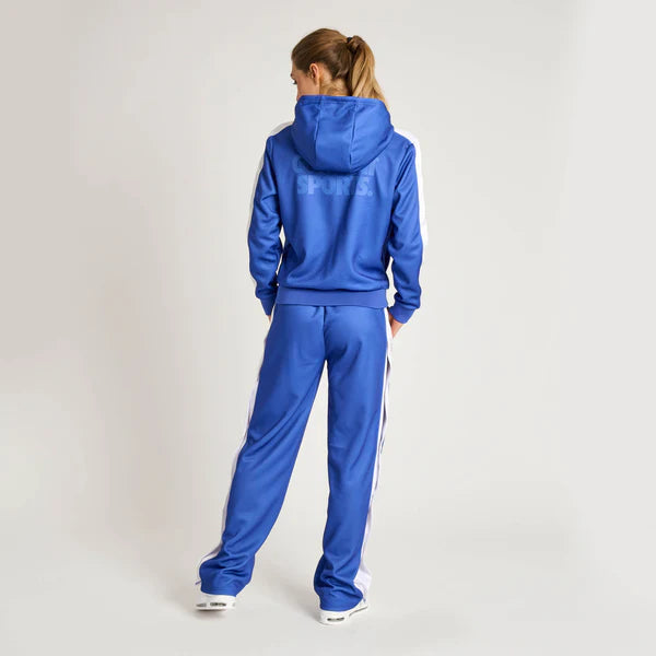 Rear view of the blue Leone Stripe women's jumpsuit that highlights the modern cut