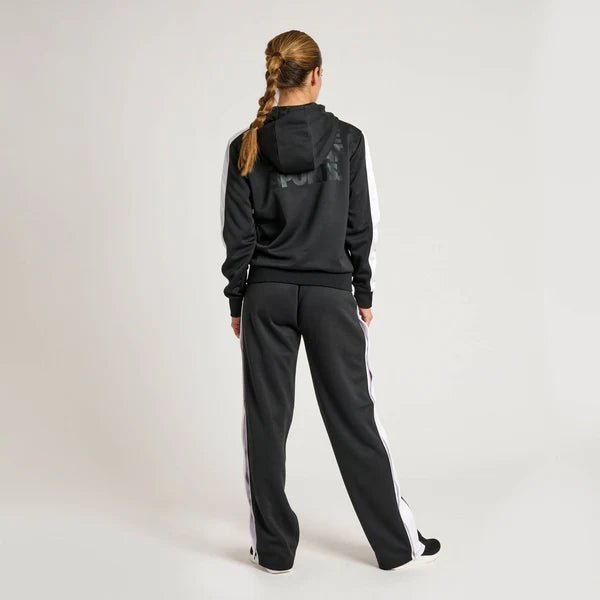 Rear view of the black women's Leone Stripe tracksuit showing the hood and fit