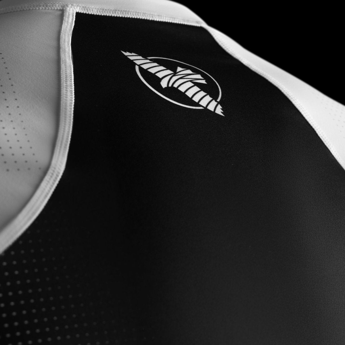 Close-up of the official Hayabusa logo printed on the chest of the white Pro Ranked rashguard