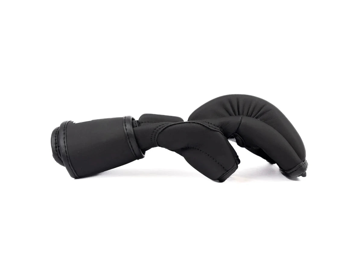 Side view of The Claw MMA gloves, thumb protection detail and padding thickness