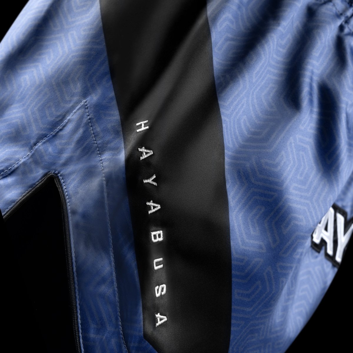 Detail of the deep kick side slit of the blue Hayabusa Core Shorts