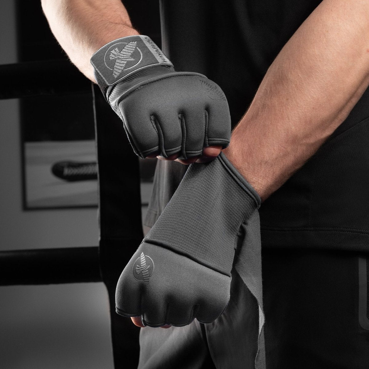 Gray Hayabusa Deluxe Quick Wraps under-gloves worn for boxing training