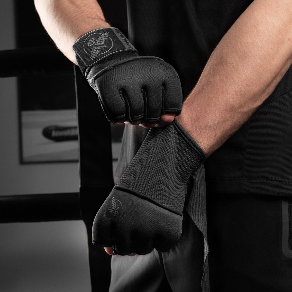 Boxer with Hayabusa Deluxe black undergloves worn, ready for use under gloves