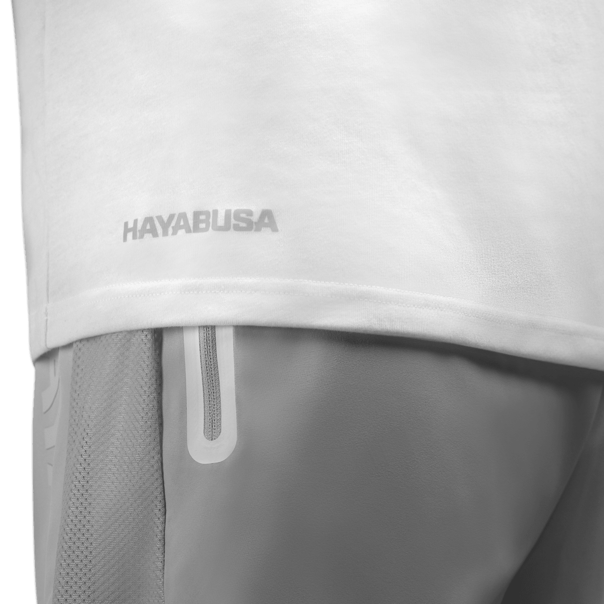 Side view of the white Hayabusa Essential T-shirt, detail of the low hem finish