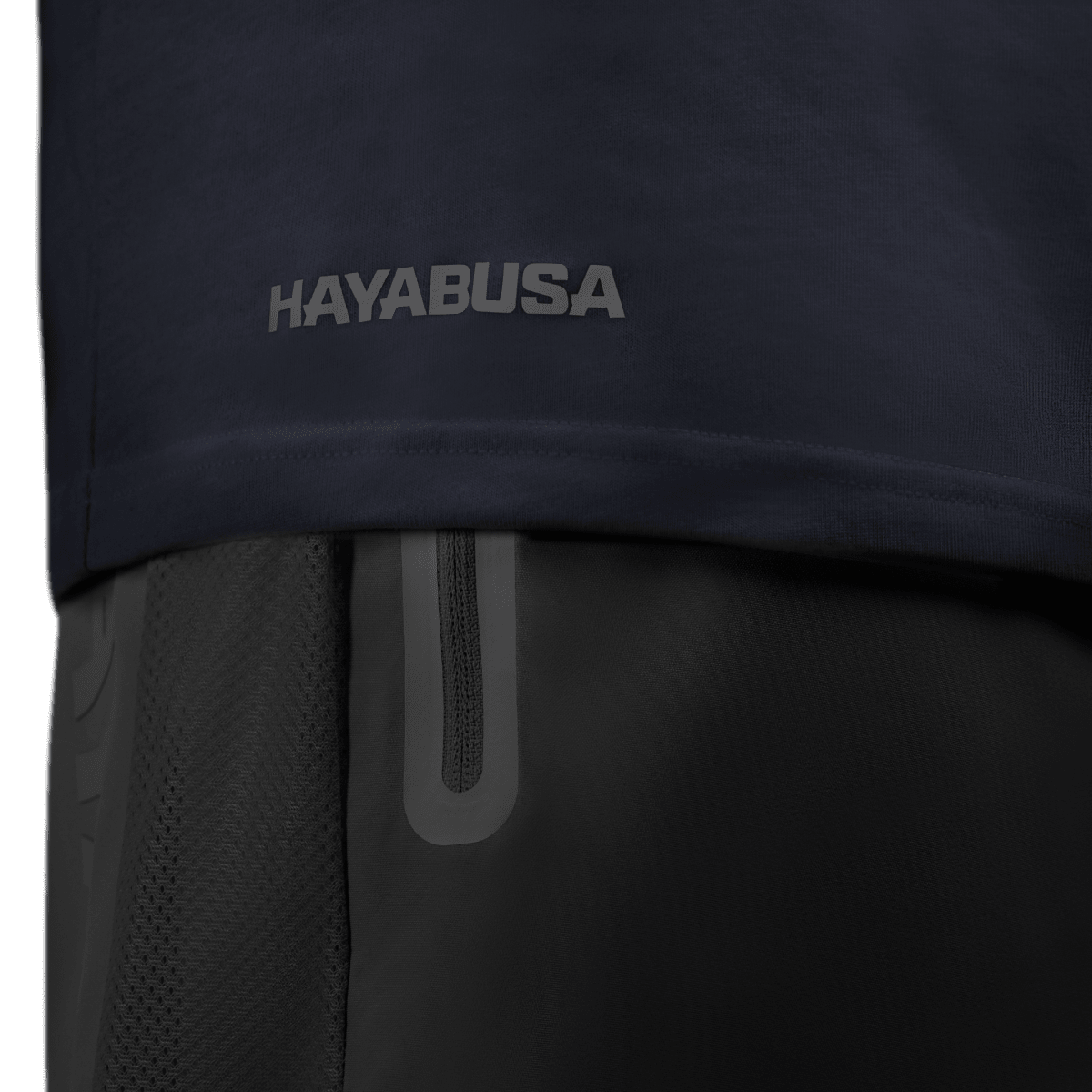 Side view of the navy blue Hayabusa Essential T-shirt, detail of the reinforced stitching on the low hem